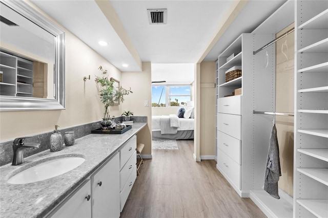 bathroom featuring vanity and hardwood / wood-style flooring