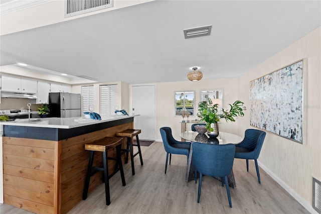 dining room featuring light hardwood / wood-style floors