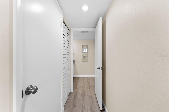 hallway featuring light wood-type flooring