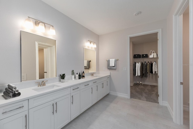 bathroom with tile patterned floors and vanity