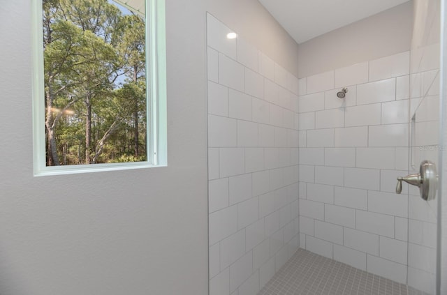 bathroom with tiled shower