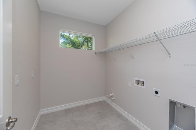 washroom with electric dryer hookup and hookup for a washing machine