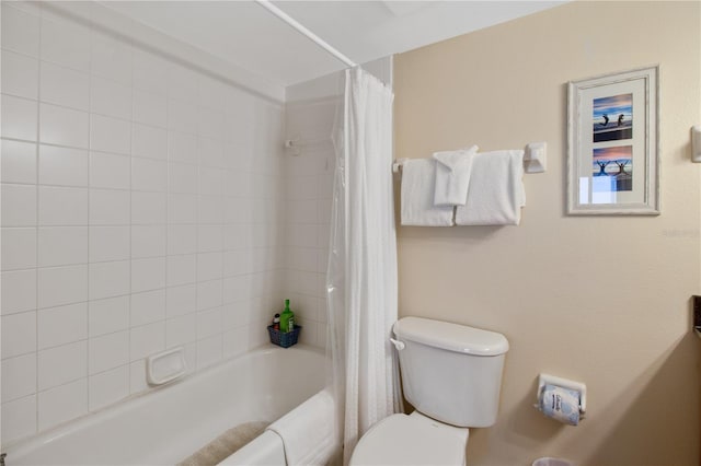 bathroom with shower / tub combo and toilet