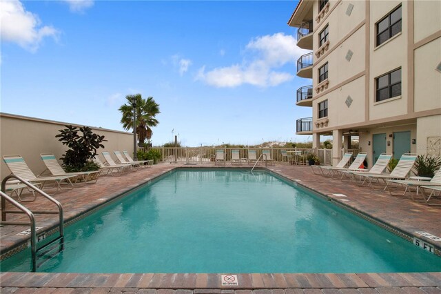 view of pool featuring a patio area