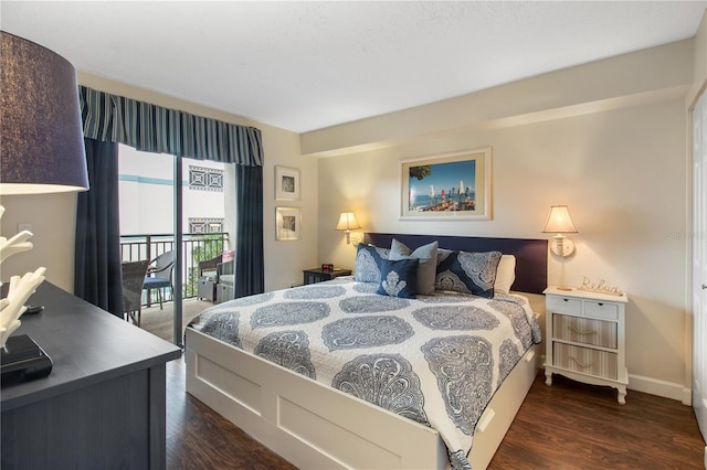 bedroom featuring dark hardwood / wood-style floors and access to exterior