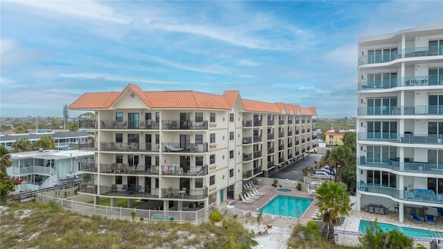 view of property featuring a community pool