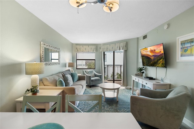 living room featuring a textured ceiling