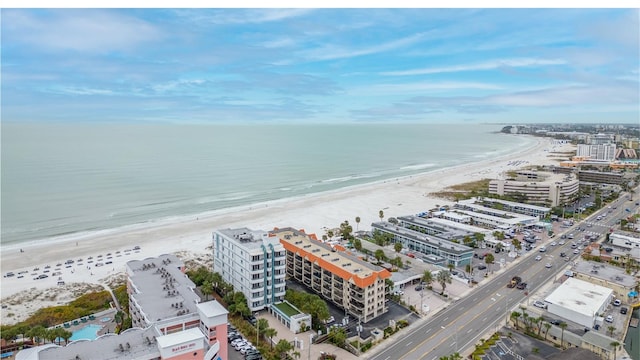 drone / aerial view with a water view and a view of the beach