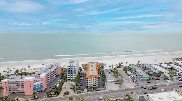 drone / aerial view with a water view and a view of the beach