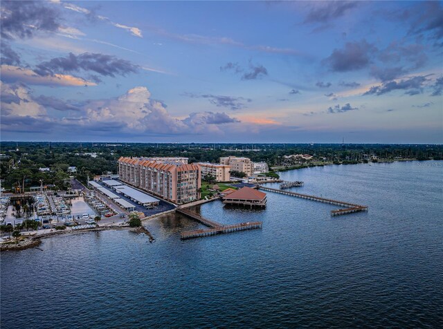 aerial view at dusk with a water view