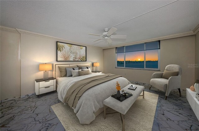 bedroom with ceiling fan, ornamental molding, and a textured ceiling