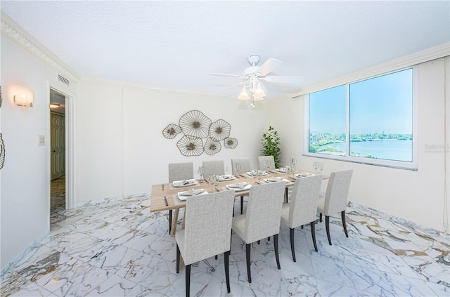 634 Edgewater Dr Unit 644, Dunedin, FL 34698 - dining space with visible vents, marble finish floor, crown molding, and ceiling fan