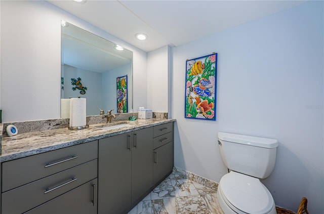 634 Edgewater Dr Unit 644, Dunedin, FL 34698 - bathroom with vanity, baseboards, recessed lighting, toilet, and marble finish floor