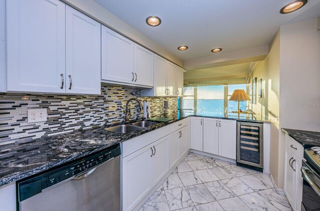 kitchen featuring white cabinetry, sink, wine cooler, and appliances with stainless steel finishes