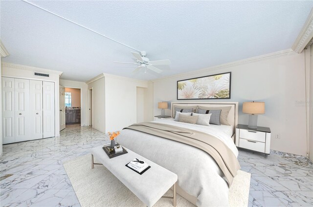 bedroom featuring crown molding, ceiling fan, and a textured ceiling