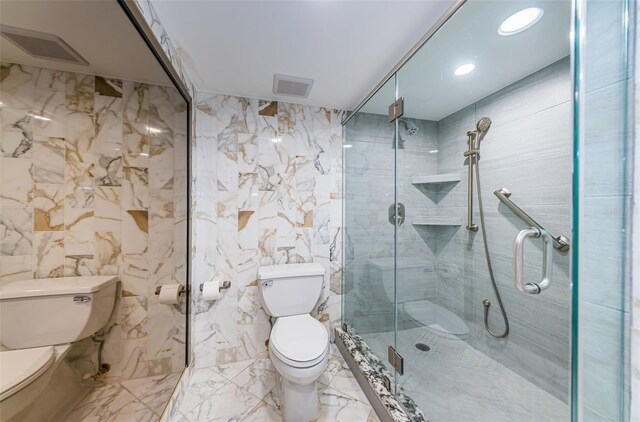 bathroom featuring walk in shower, toilet, and tile walls