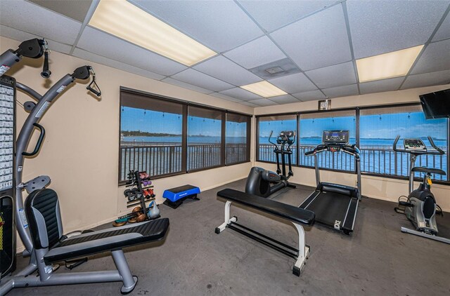 exercise room with a drop ceiling