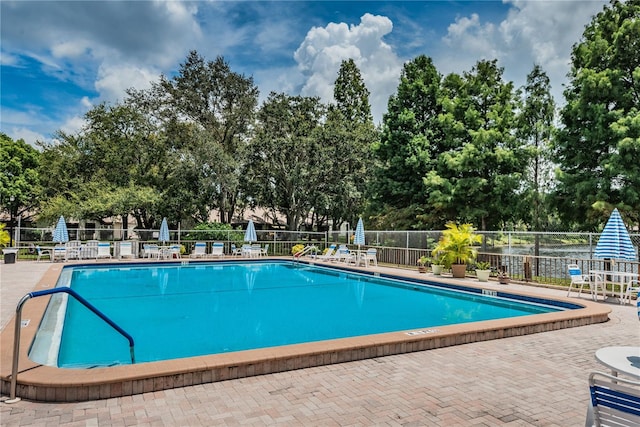 view of swimming pool featuring a patio area