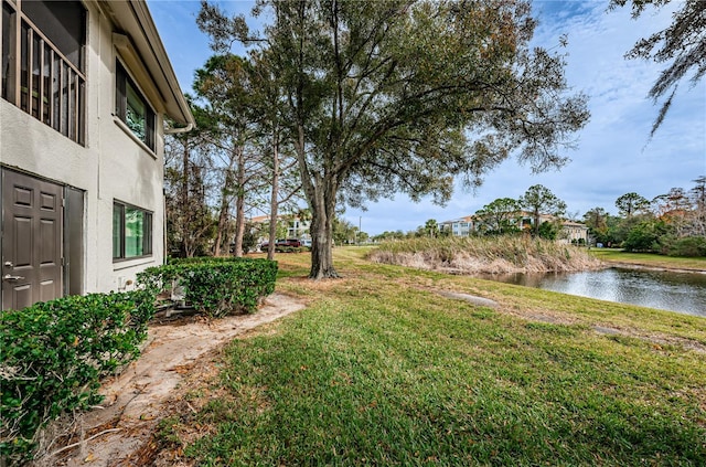 view of yard with a water view