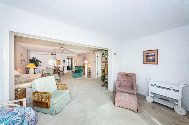 interior space with ceiling fan and a textured ceiling