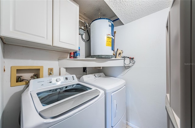 laundry room with hookup for an electric dryer, cabinets, hookup for a washing machine, a textured ceiling, and separate washer and dryer