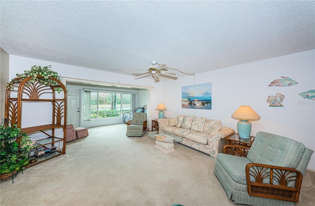 living room featuring light carpet, a textured ceiling, and ceiling fan