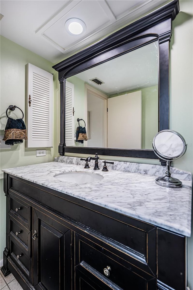 bathroom featuring tile floors and vanity