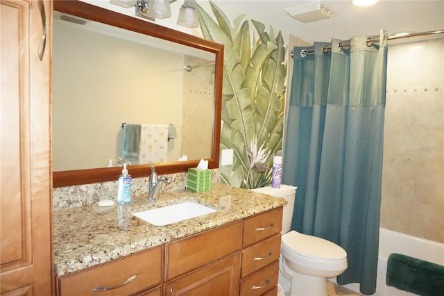 full bathroom featuring toilet, vanity, and shower / bath combo with shower curtain