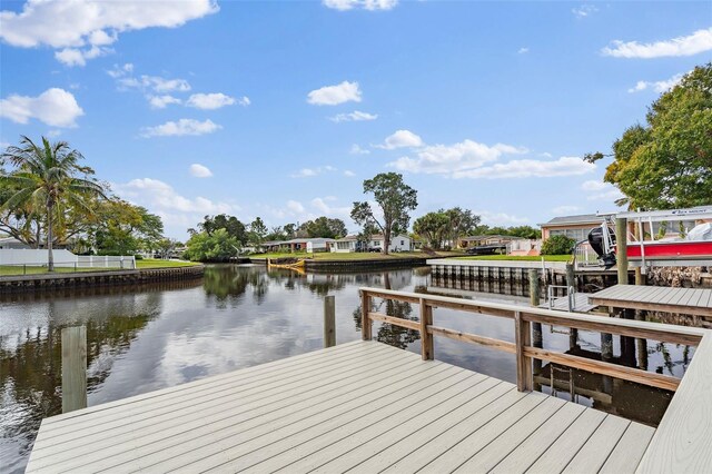 dock area featuring a water view and boat lift