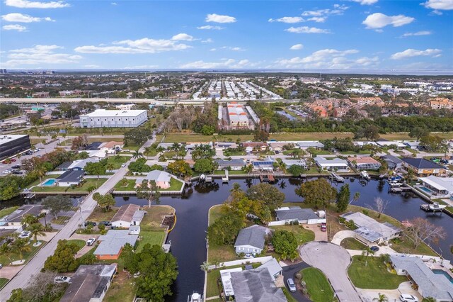 birds eye view of property featuring a water view and a residential view