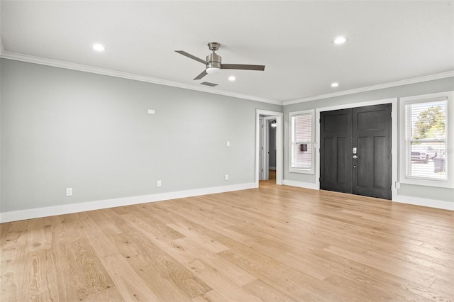 interior space featuring light wood-style flooring, visible vents, and crown molding