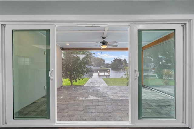 doorway to outside with a ceiling fan