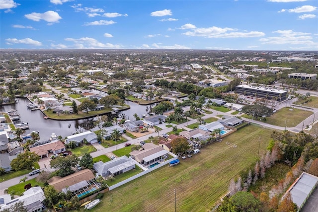 bird's eye view with a water view and a residential view