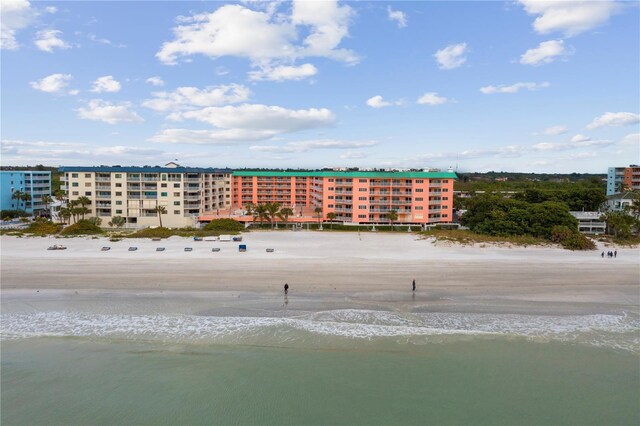 bird's eye view with a water view and a beach view