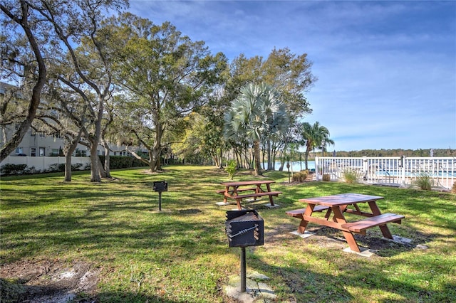 view of property's community with a lawn