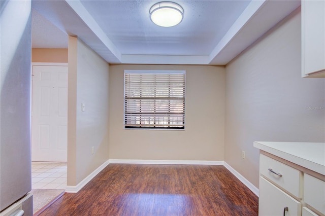 unfurnished room with dark hardwood / wood-style floors