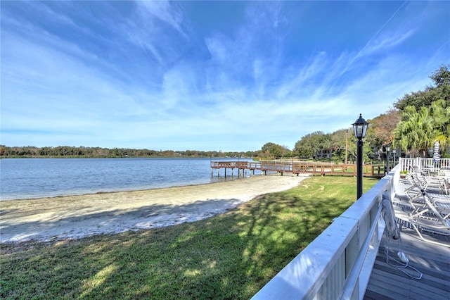 dock area featuring a yard and a water view