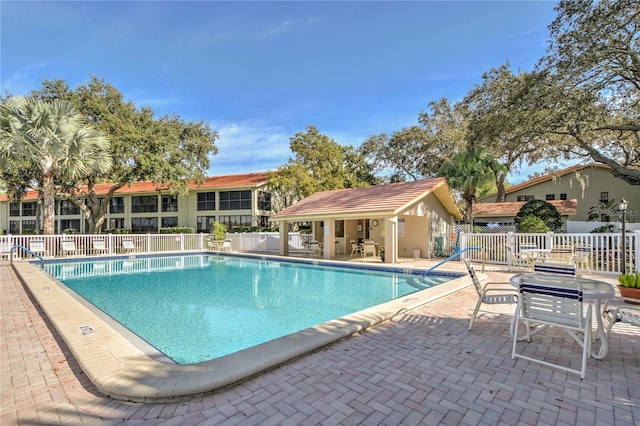 view of swimming pool with a patio