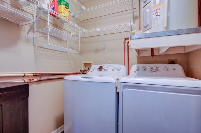 laundry area with independent washer and dryer