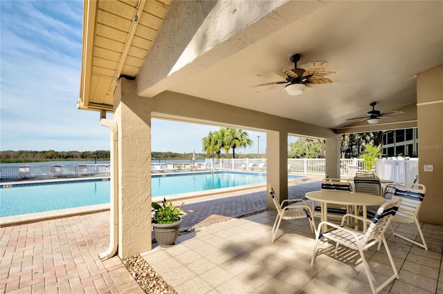 view of pool featuring a patio area and ceiling fan