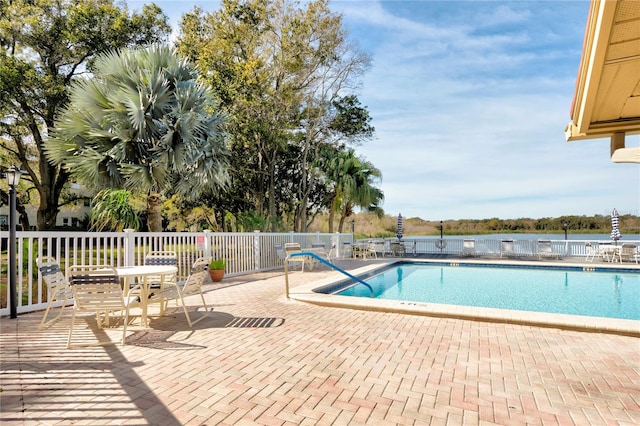 view of swimming pool with a patio area