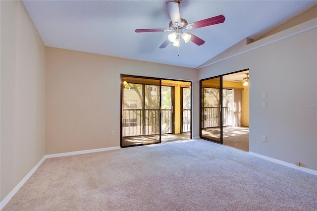 unfurnished room with light carpet, vaulted ceiling, and ceiling fan