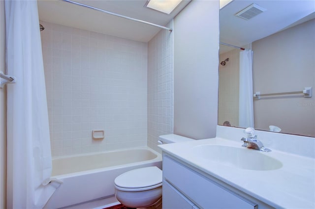 full bathroom with vanity, toilet, and shower / tub combo