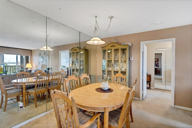 dining area with light carpet