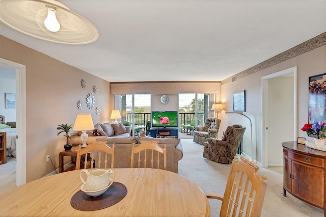 dining area with light carpet