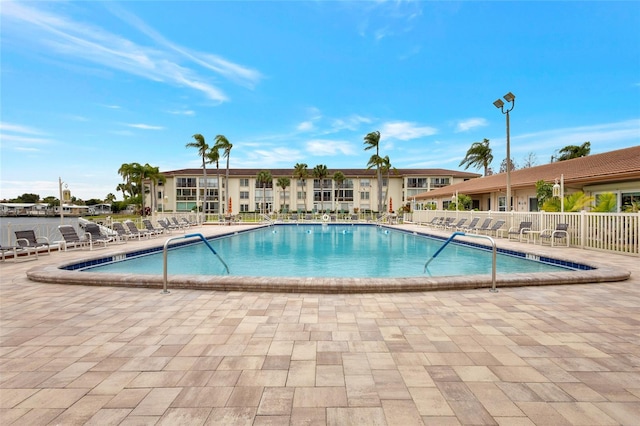 view of swimming pool with a patio area