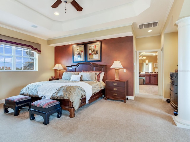 bedroom featuring crown molding, light colored carpet, ceiling fan, and a tray ceiling