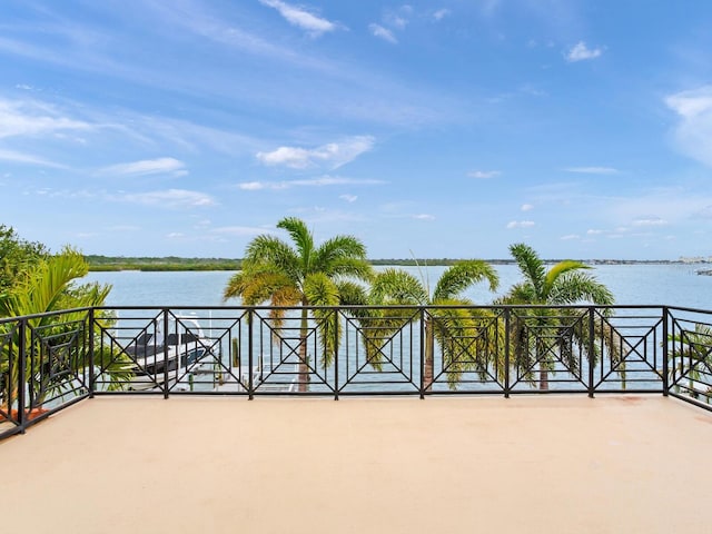 view of patio with a water view