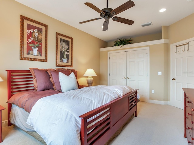 bedroom featuring light carpet and ceiling fan