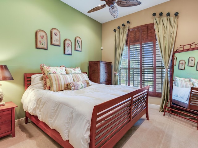 bedroom featuring ceiling fan and light carpet